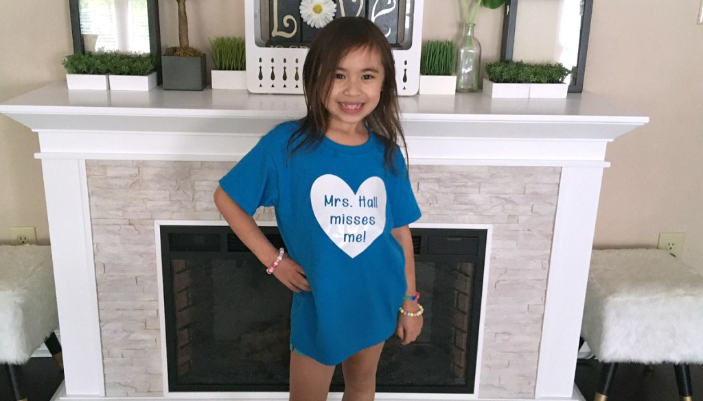 girl standing in front of fireplace