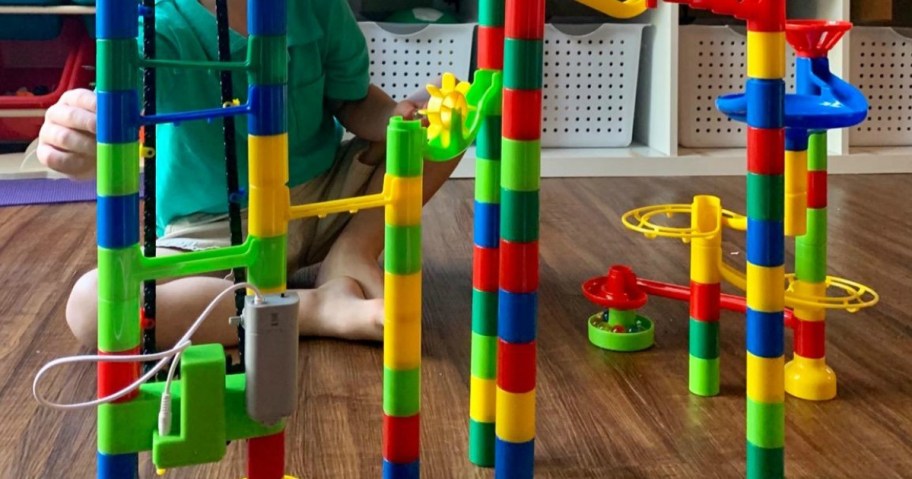 little boy playing with marble run, one of the fun indoor activities for kids in 2024 