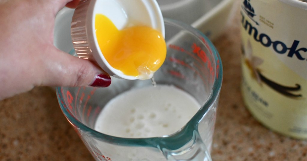 pouring egg yolk in a bowl