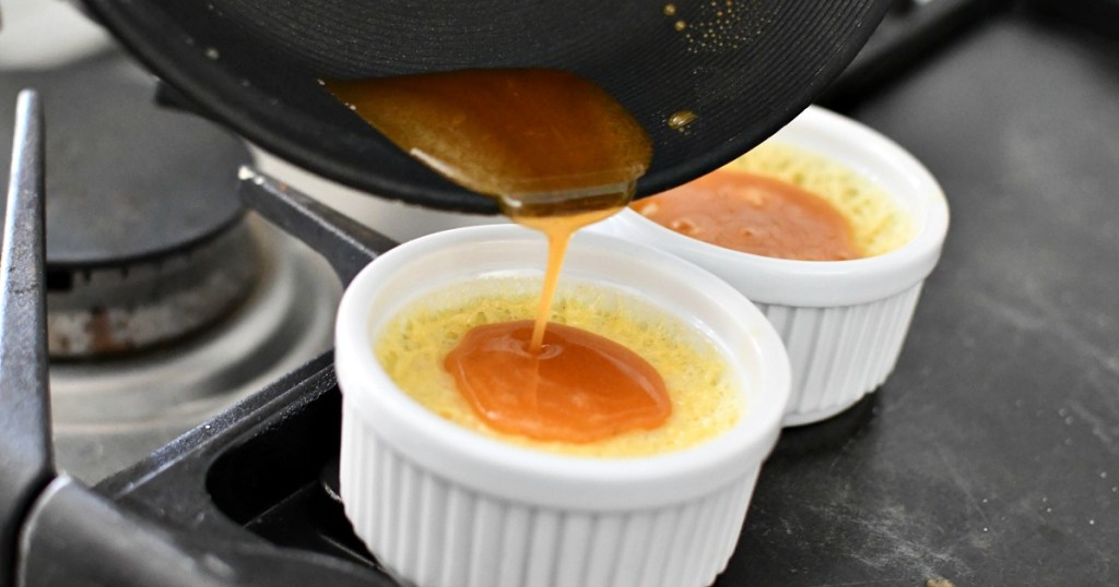 pouring sugar on top of creme brulee