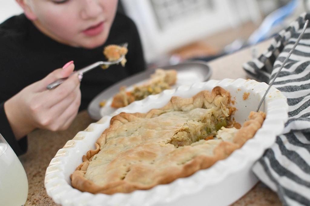 taking a bite of chicken pot pie