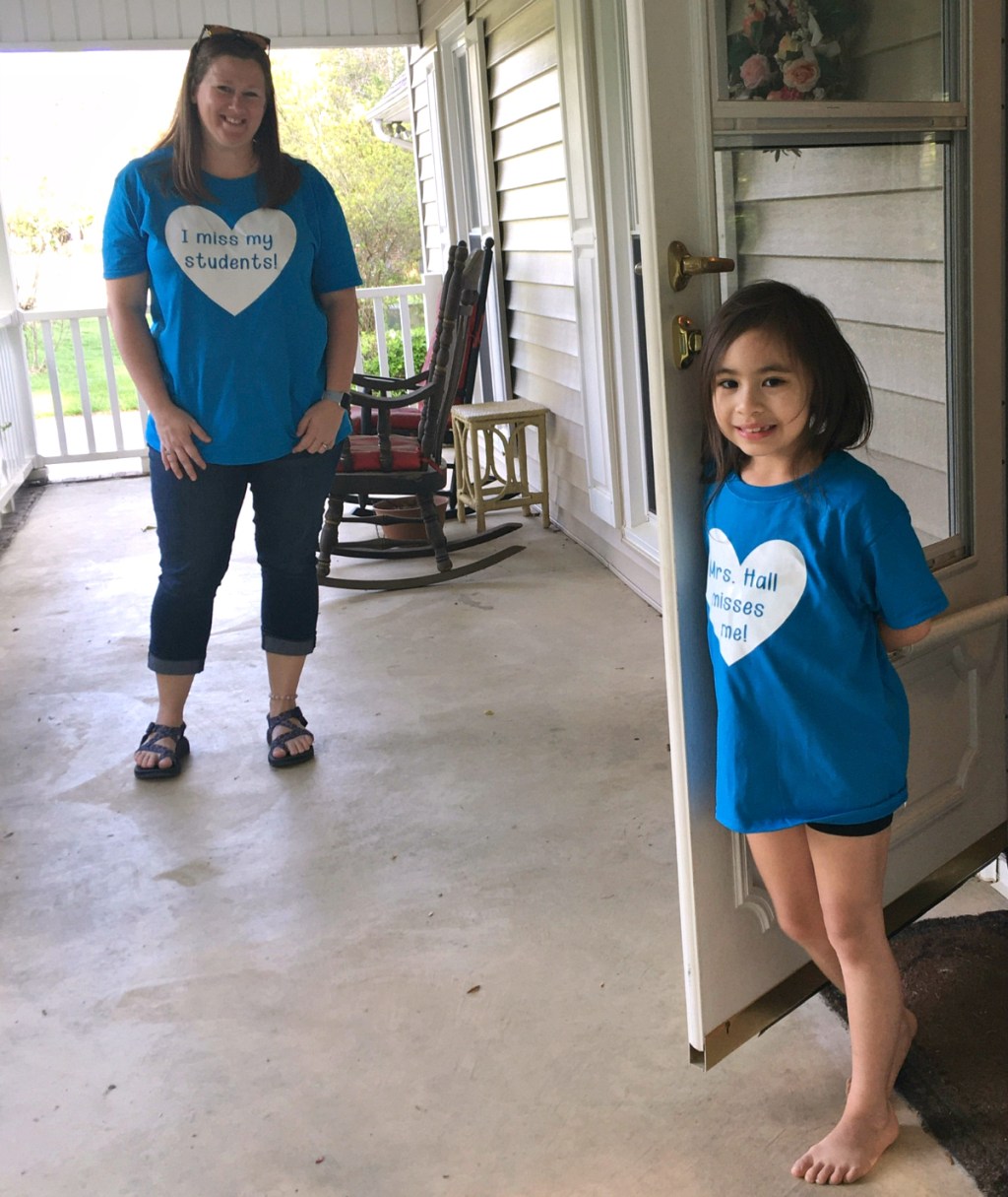 teacher and girl standing on porch