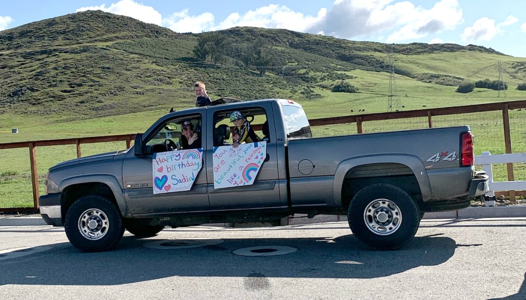 truck with people holding signs