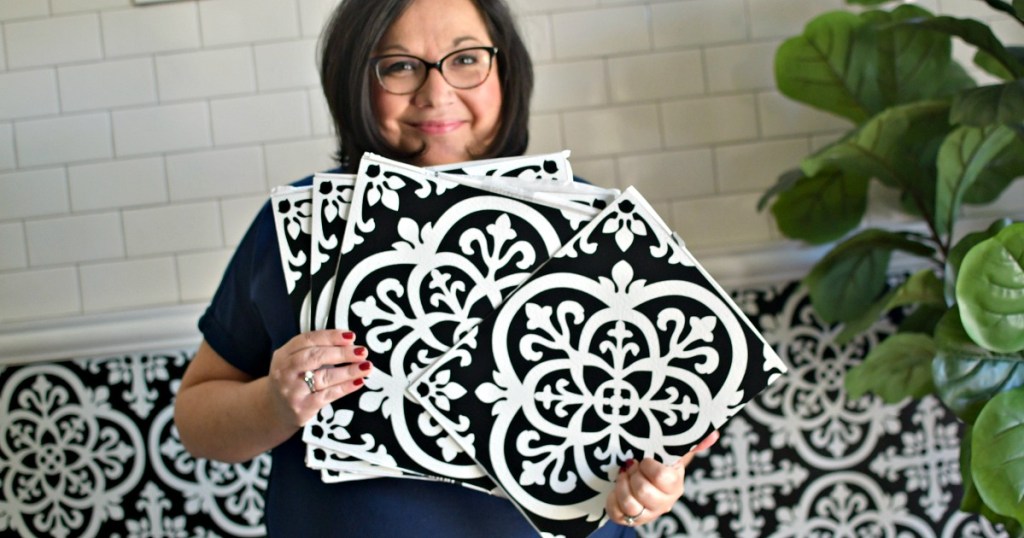 woman holding peel and stick tile