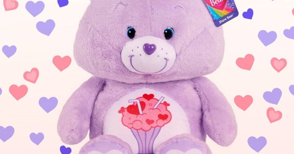 purple plush bear with hearts and milkshake design on stomach and purple and pink hearts as background