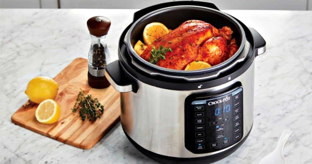 Crock-Pot Express Crock 8-Quart Pressure Cooker with whole cooked chicken