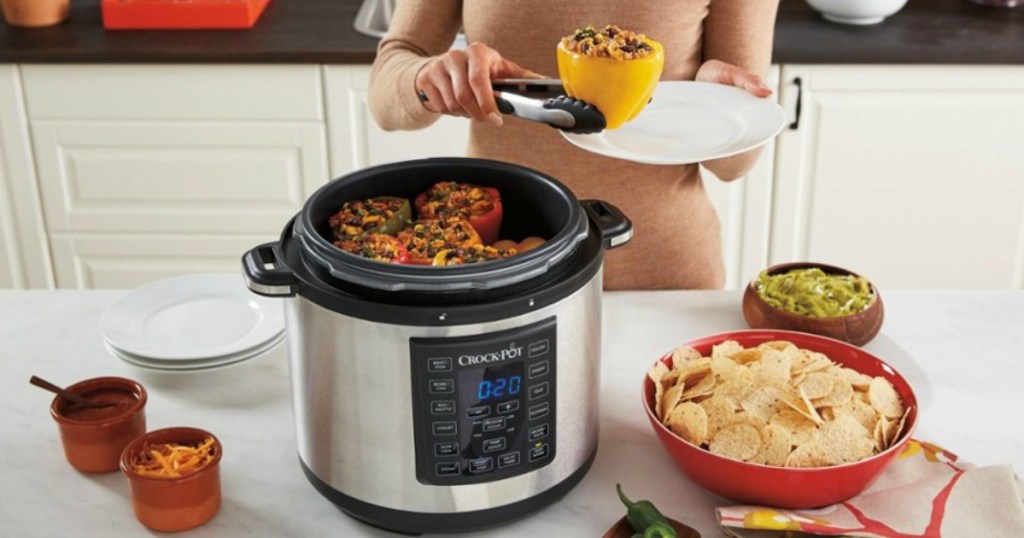 woman putting food on a plate from a pressure cooker