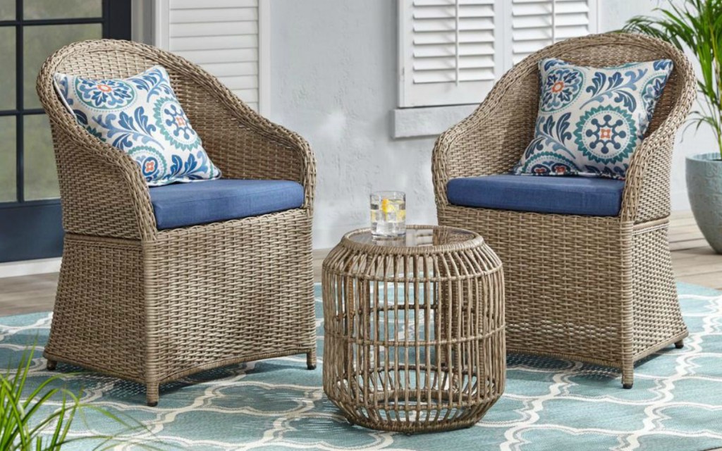 Hampton Bay furniture in wicker and blue with floral pillows