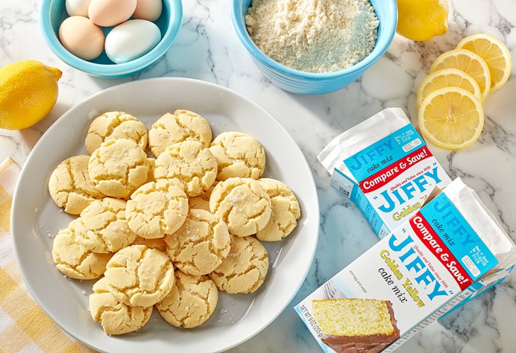 plate of cookies next to lemons and two boxes of jiffy yellow cake mix