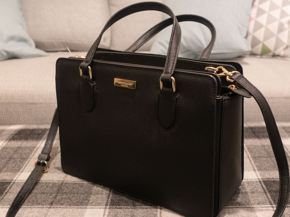 black satchel bag on table in front of couch