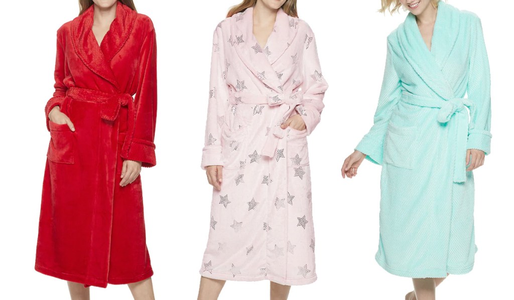 three women modeling bath robes in red, pink with stars, and mint green colors