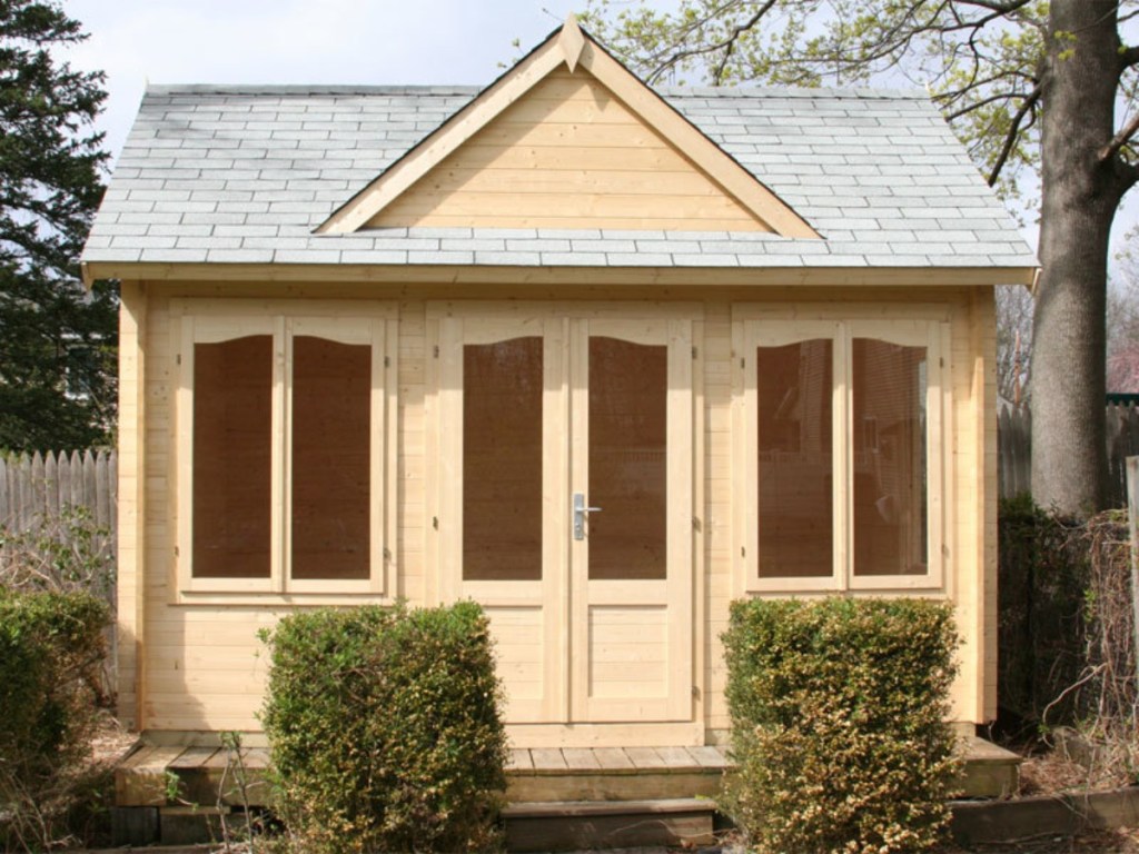 unfinished backyard guest house made from pine