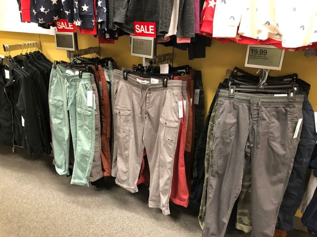 womens capri pants hanging on wall at store