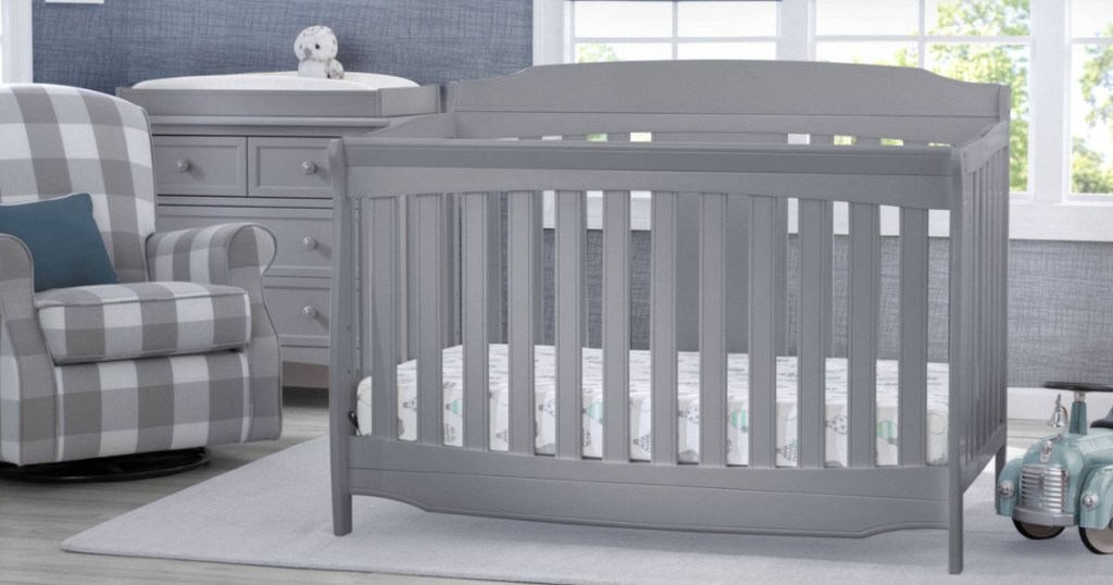 gray crib in baby nursery