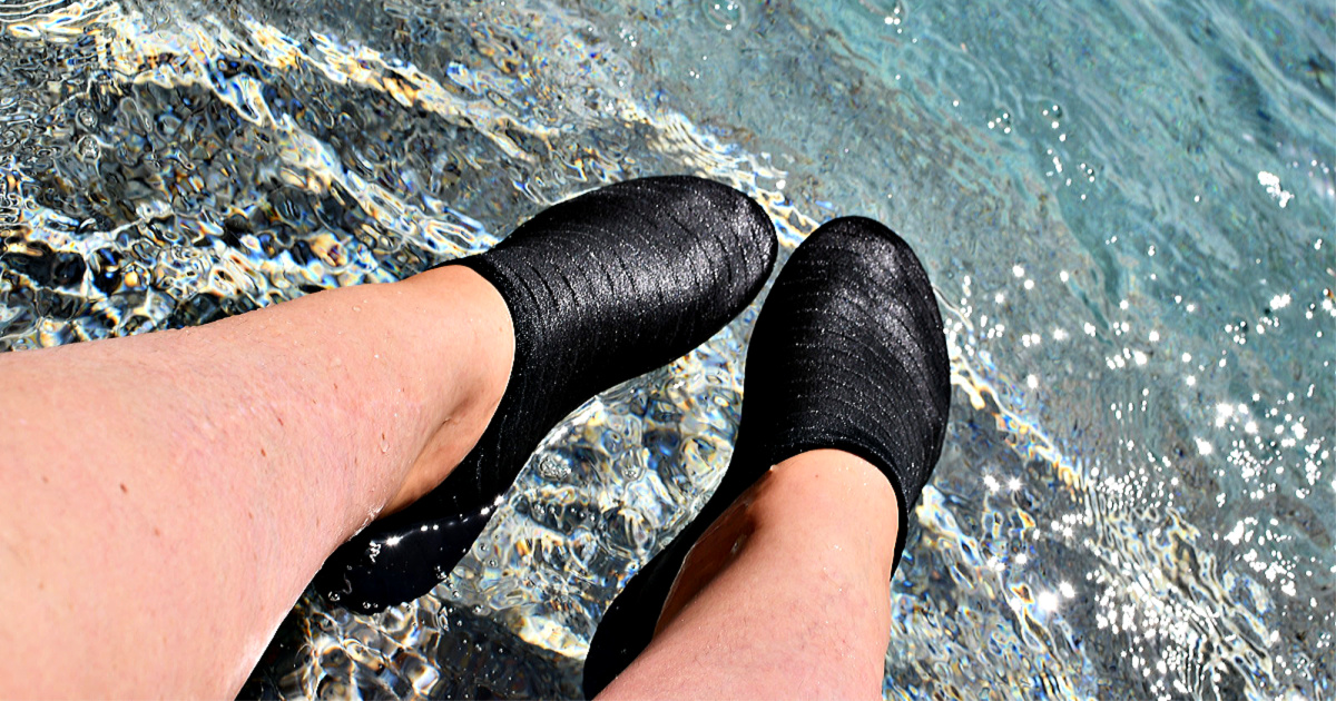 Water shoes on person's feet in water