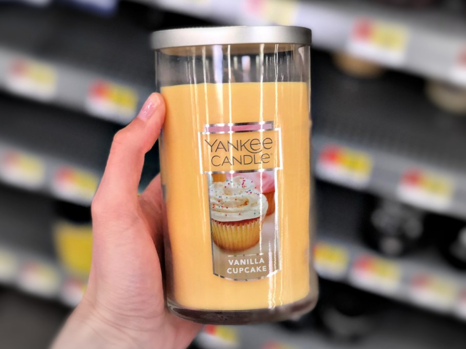 Yankee Medium Jar Candle Vanilla Cupcake in person's hand