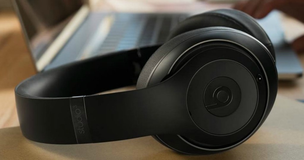 headphones sitting by a onlineputer