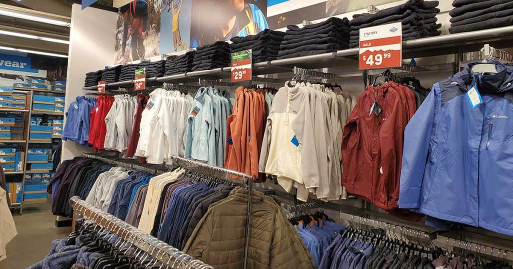 row of jackets hanging in store during spring sale