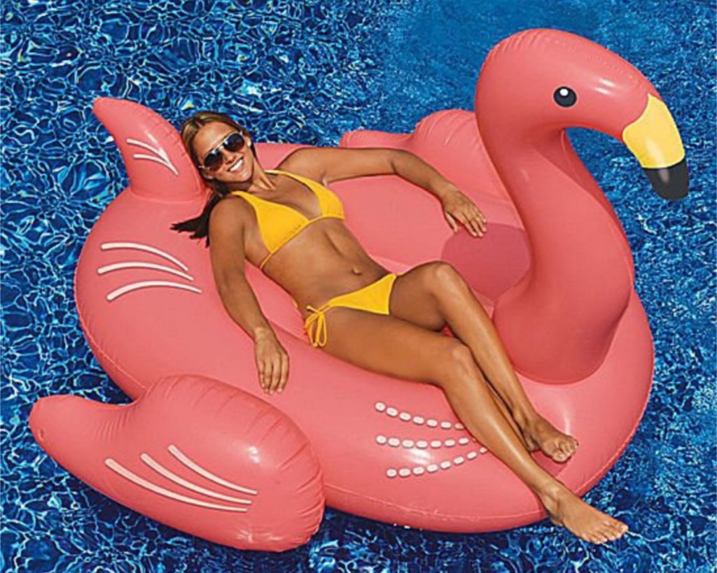 flamingo pool float with woman on it