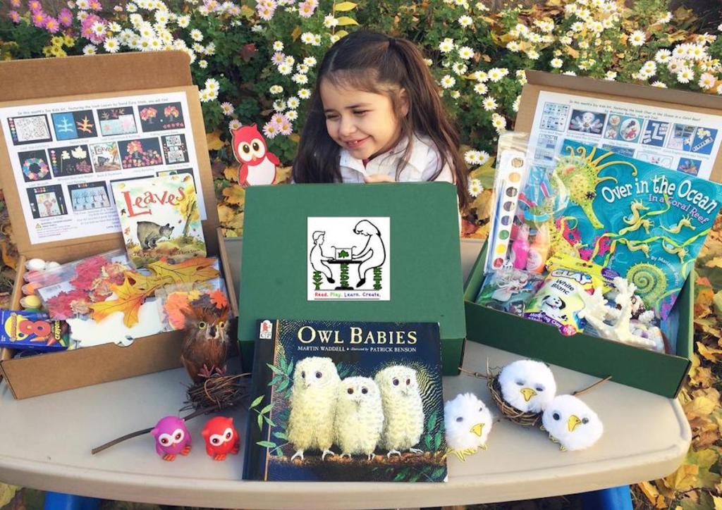 girl sitting in front of best subscription boxes for kids 