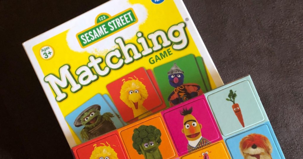 sesame street matching game with game pieces on top