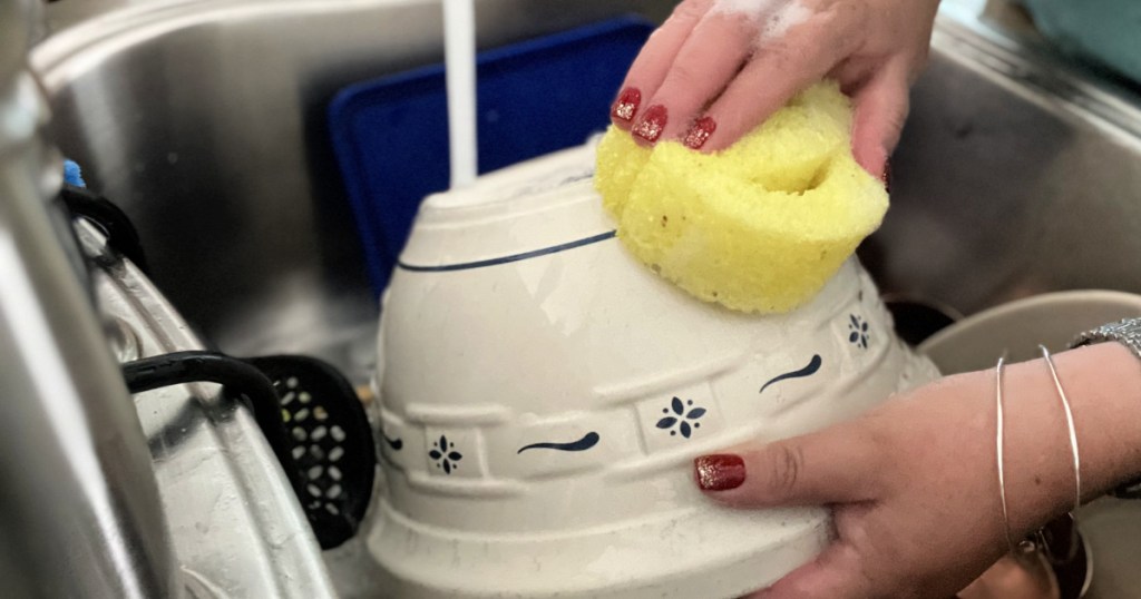 using a scrub daddy to clean a bowl