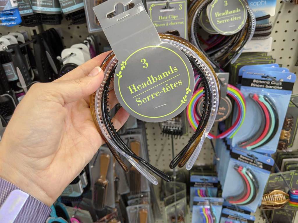 hand holding a set of 3 headbands in store