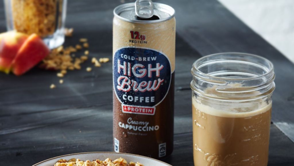 can of Cold Brew High Brew Creamy Cappuccino next to mason jar with coffee in it