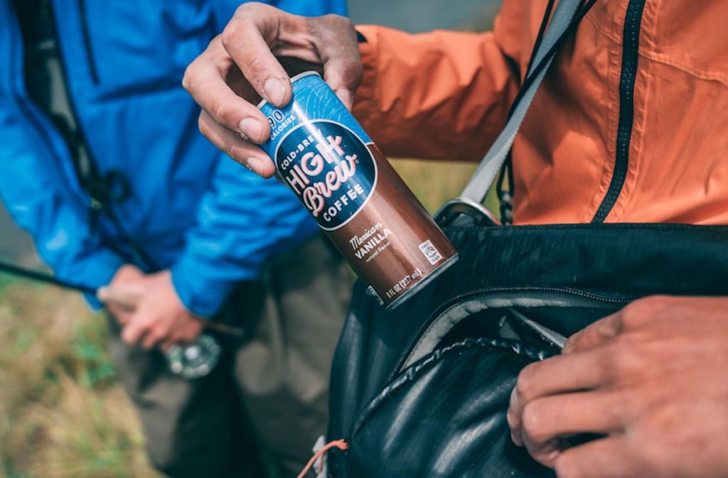 man pulling out Cold Brew High Brew Mexican Vanilla from bag