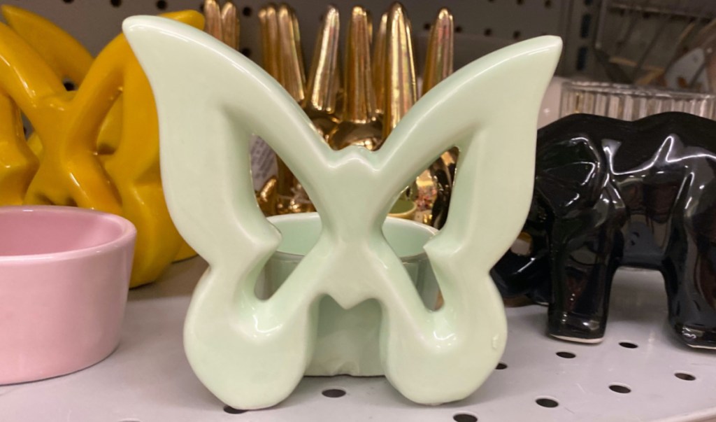 small green butterfly decor on store shelf