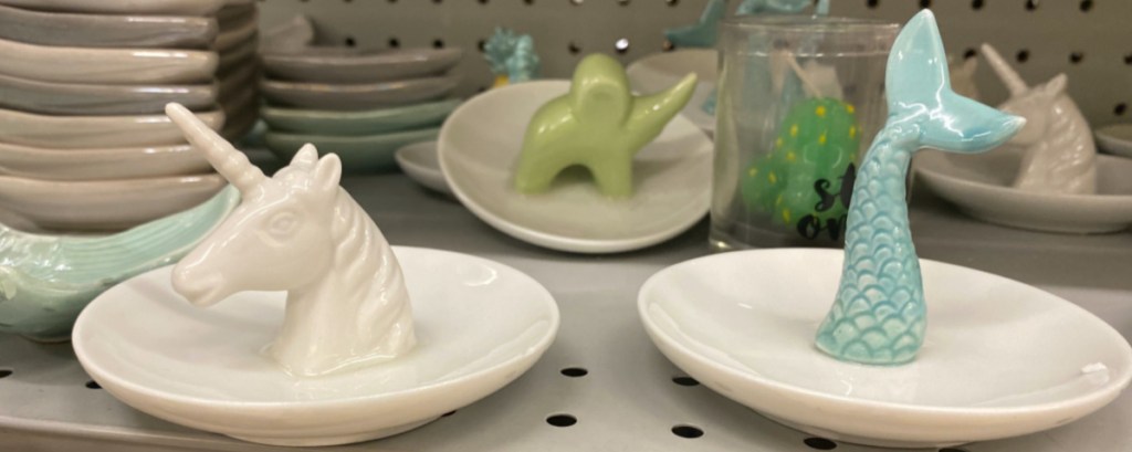 unicorn and mermaid tail ring trays on store shelf