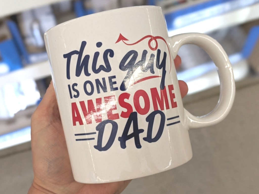 hand holding awesome dad mug at dollar tree