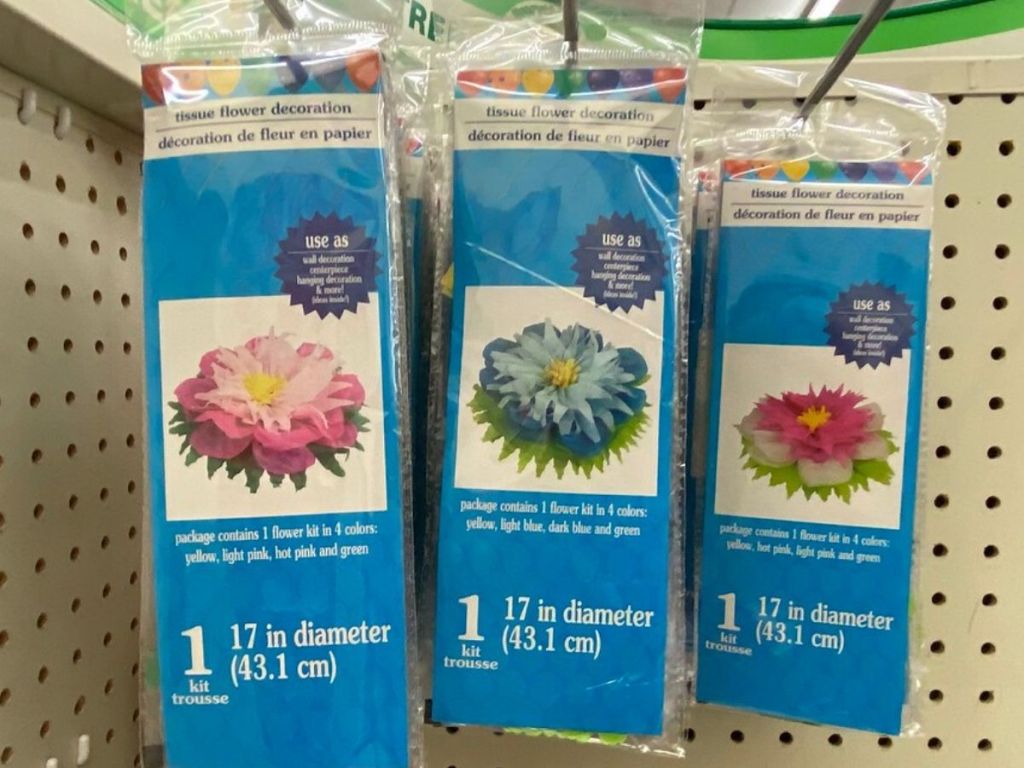 packs of tissue flowers hanging on racks at store