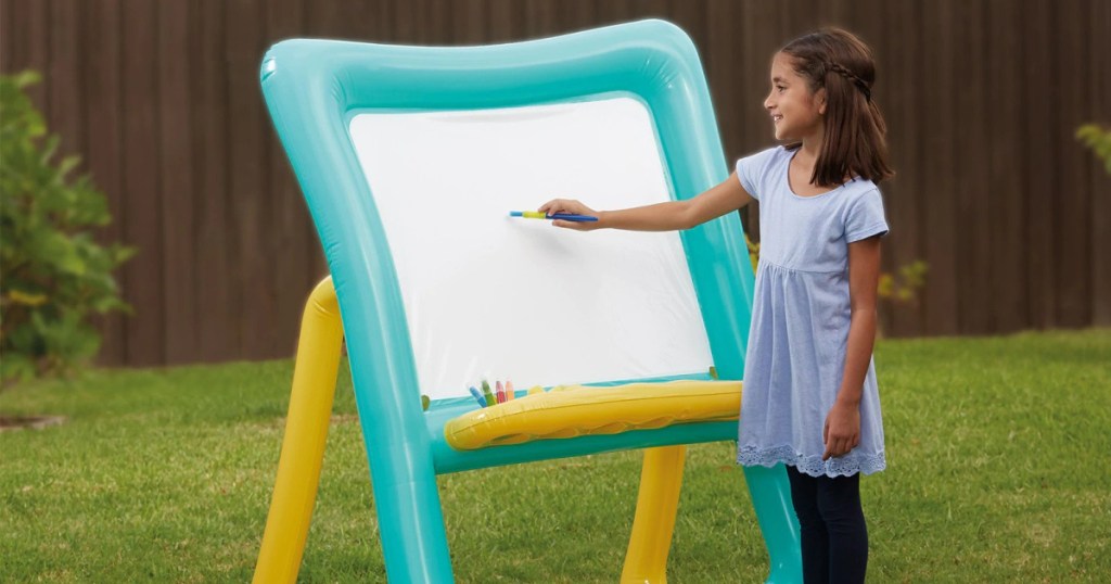 girl painting on Inflatable Easel by Creatology outside