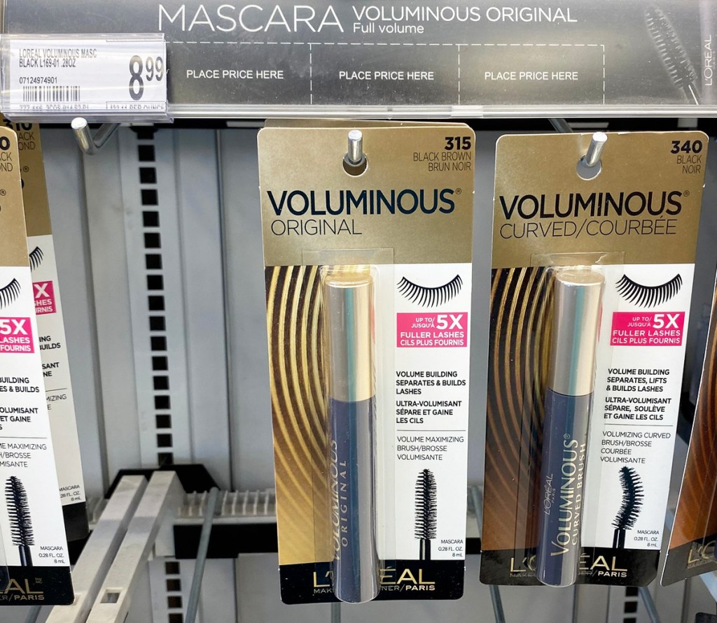 l'oreal voluminous black mascaras hanging on store display