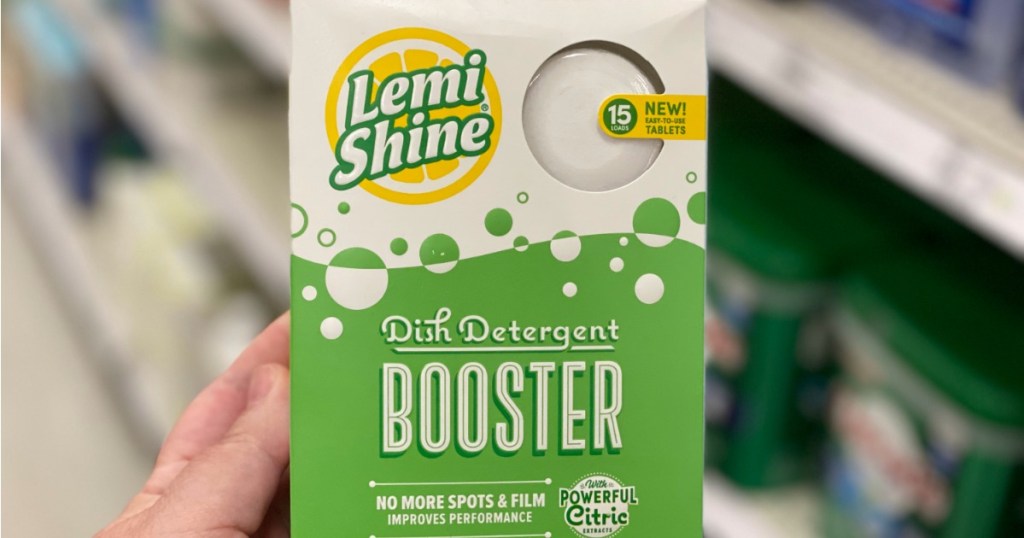 hand holding up LemiShine Dish Detergent Booster 