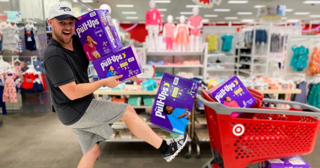 Man Loading Huggies Pull-ups into Target Cart