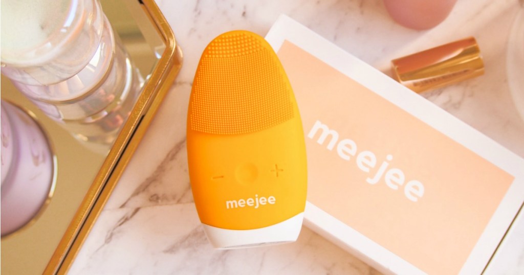 Orange MeeJee Massager and Brush