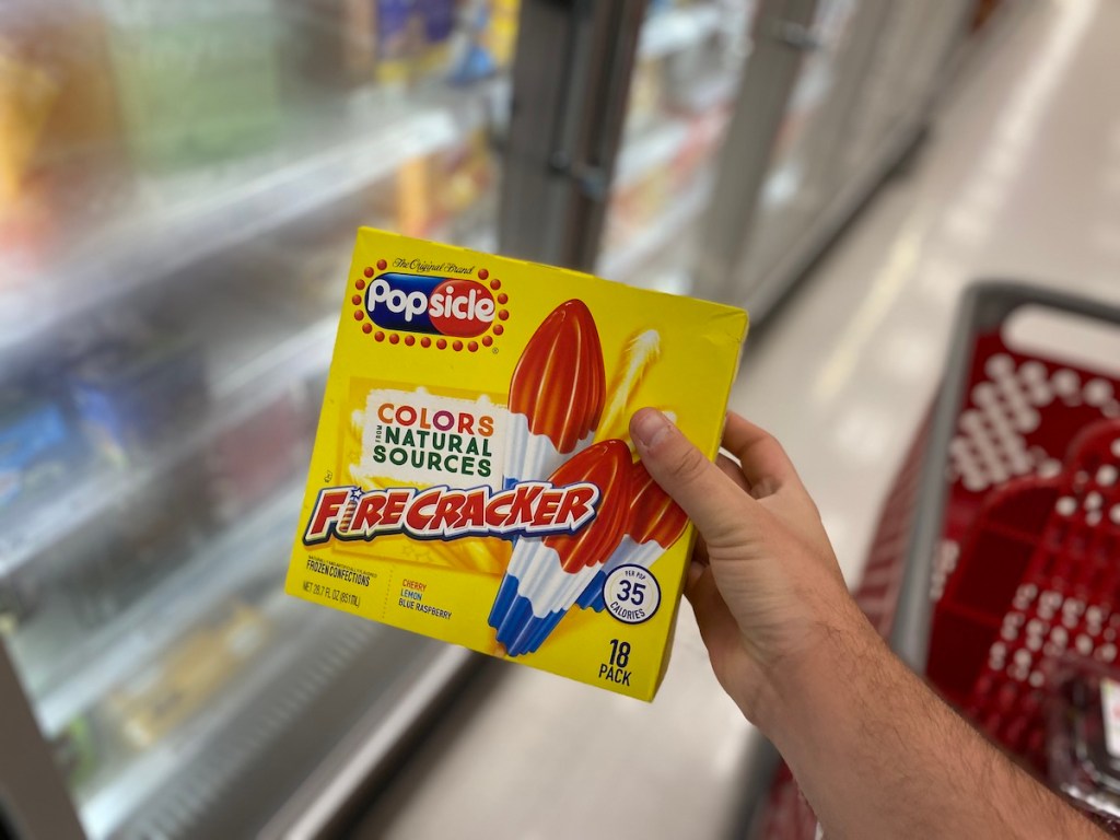 man holding box of popsicle firecracker in store