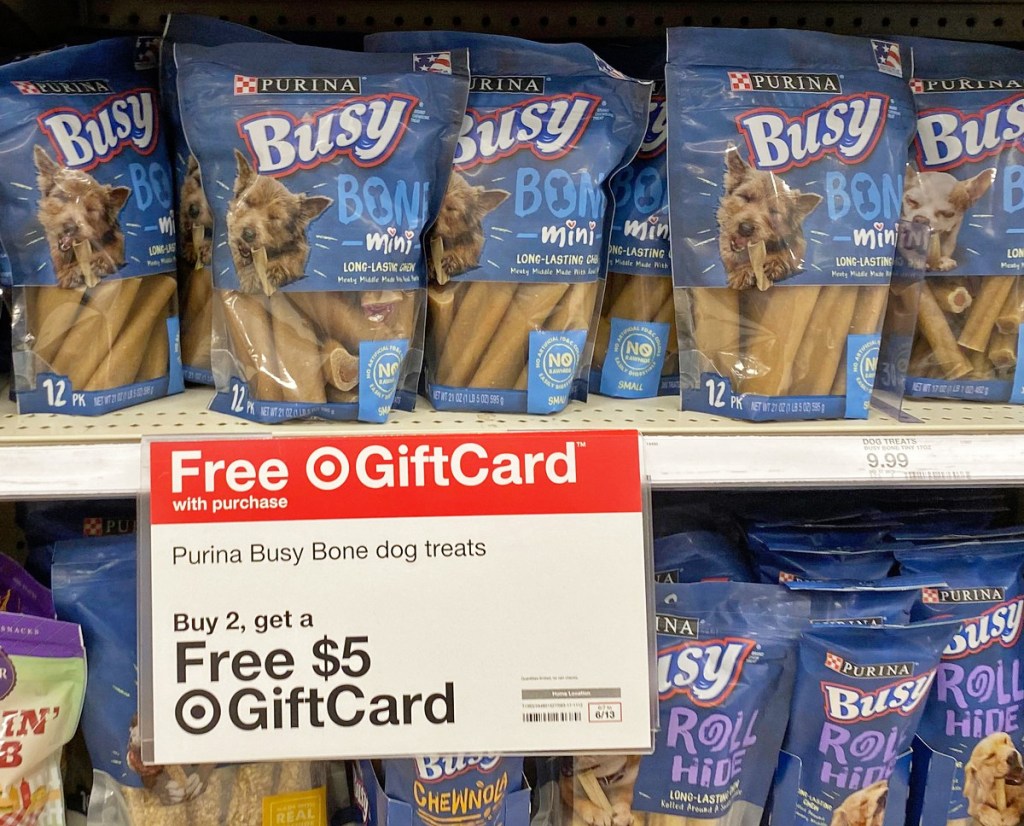 blue packages of purina dog bones on store display shelf