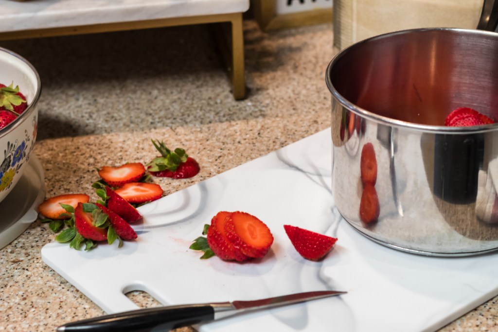 cutting up strawberries