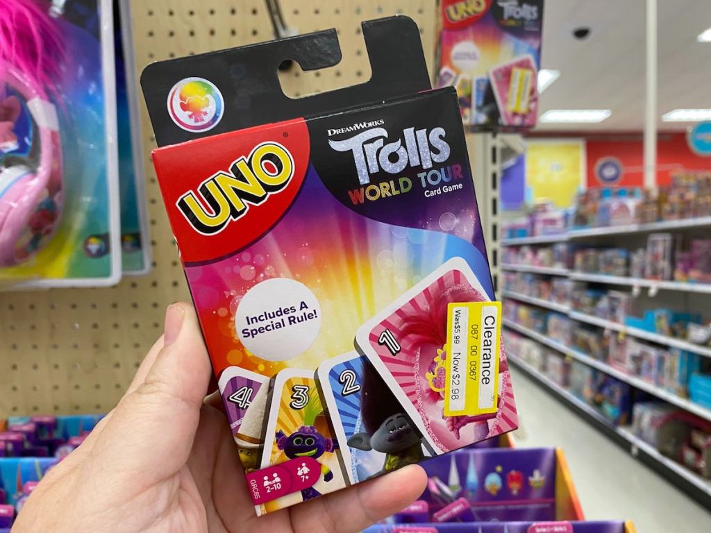 Hand holding up Uno Trolls