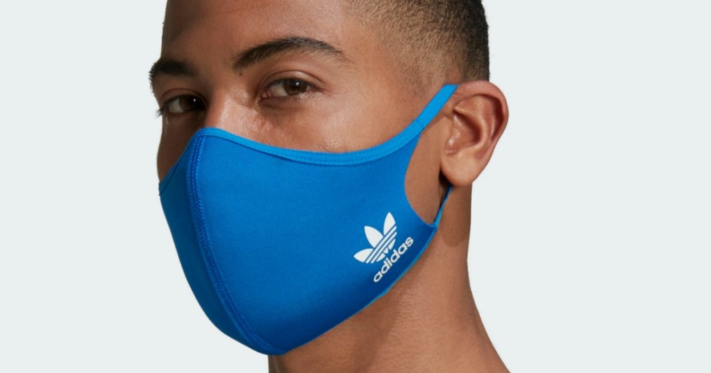 man wearing an adidas face mask