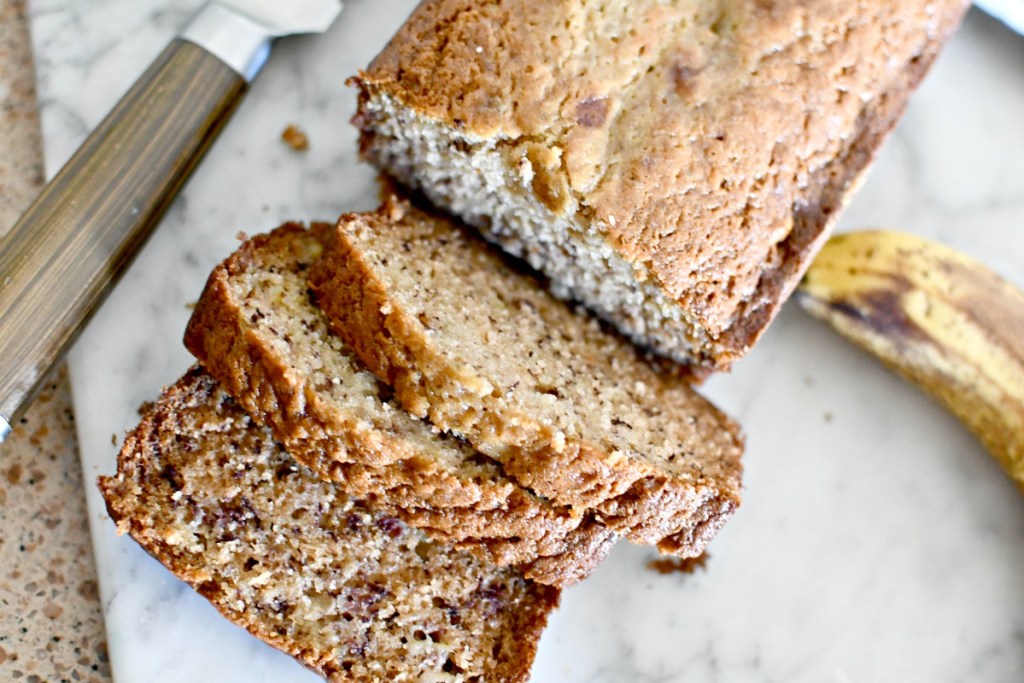 sour cream banana bread cut on the counter