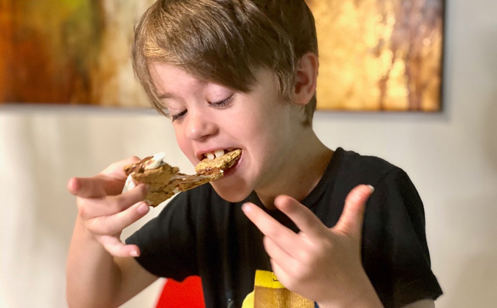 boy eating air fryer s'mores