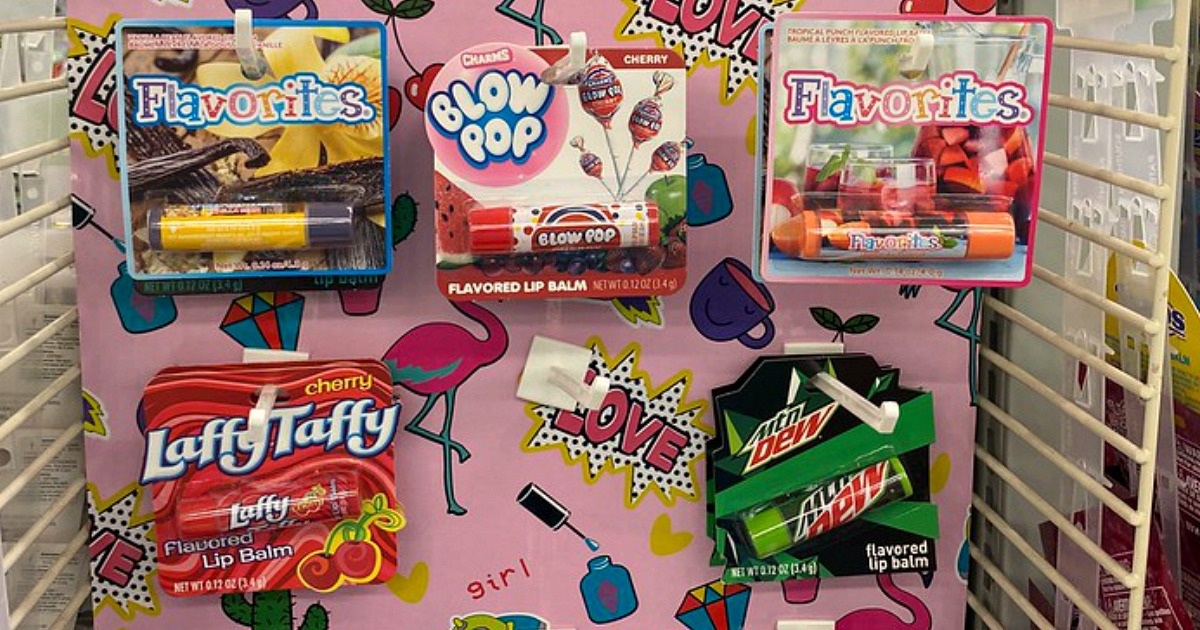 a collection of lip balms in packages on a store display