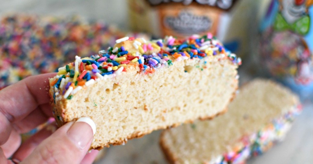 holding a slice of ice cream cake