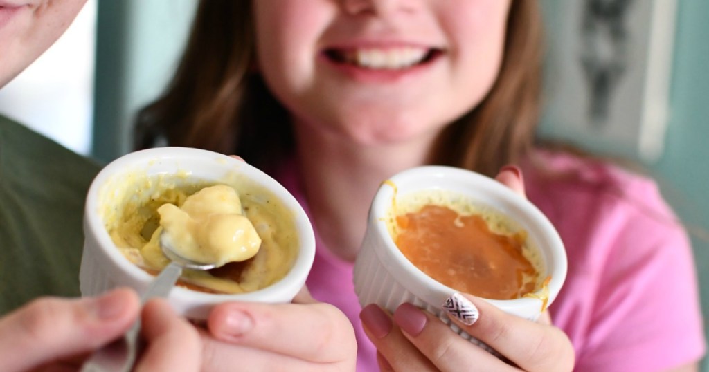 kids holding creme brulee cups 