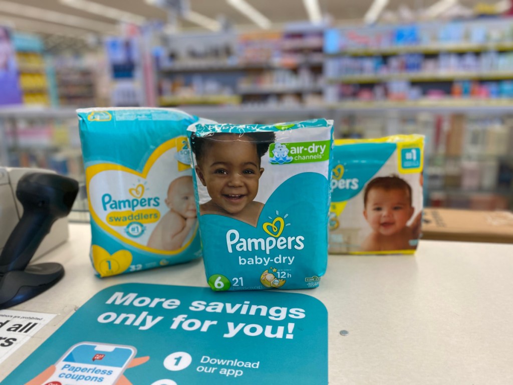 3 packs of pampers diapers on store counter