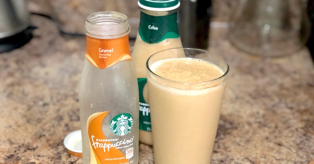 empty starbucks bottle with glass full of frappuccino